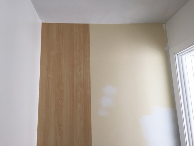 How to install lengths of adhesive wallpaper.
