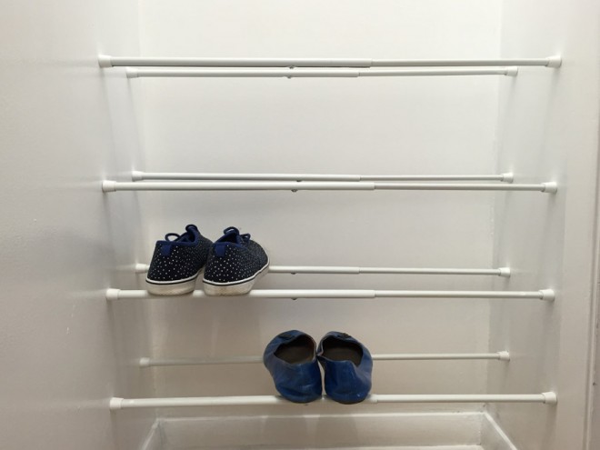 Use tension rods to store shoes in a closet.