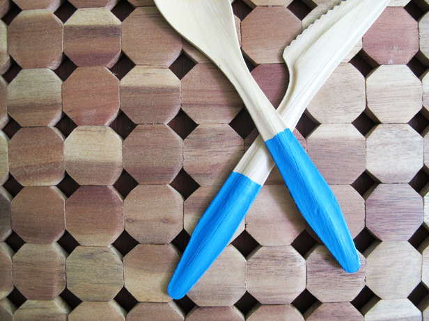 Colorblocking wooden flatware with paint.