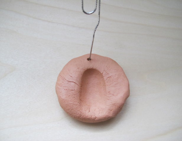 How to make clay thumbprint ornaments – an easy holiday tradition for your kids.