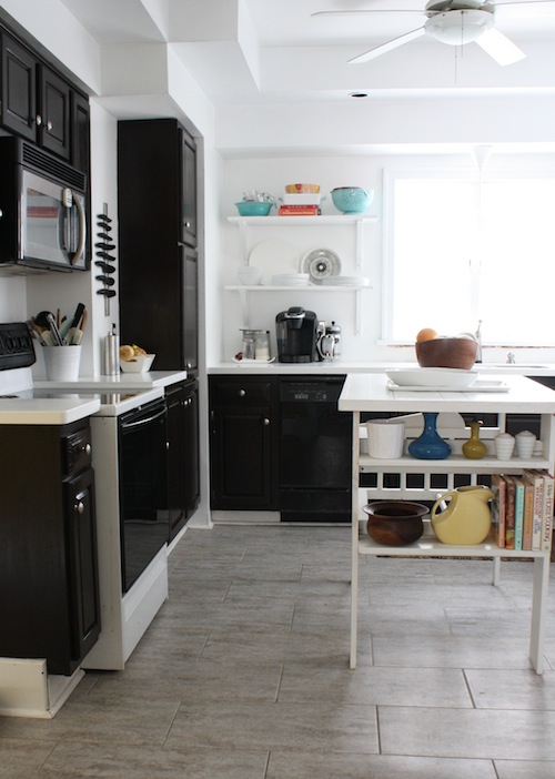 Installing vinyl gray tiles in the kitchen modernize the space.